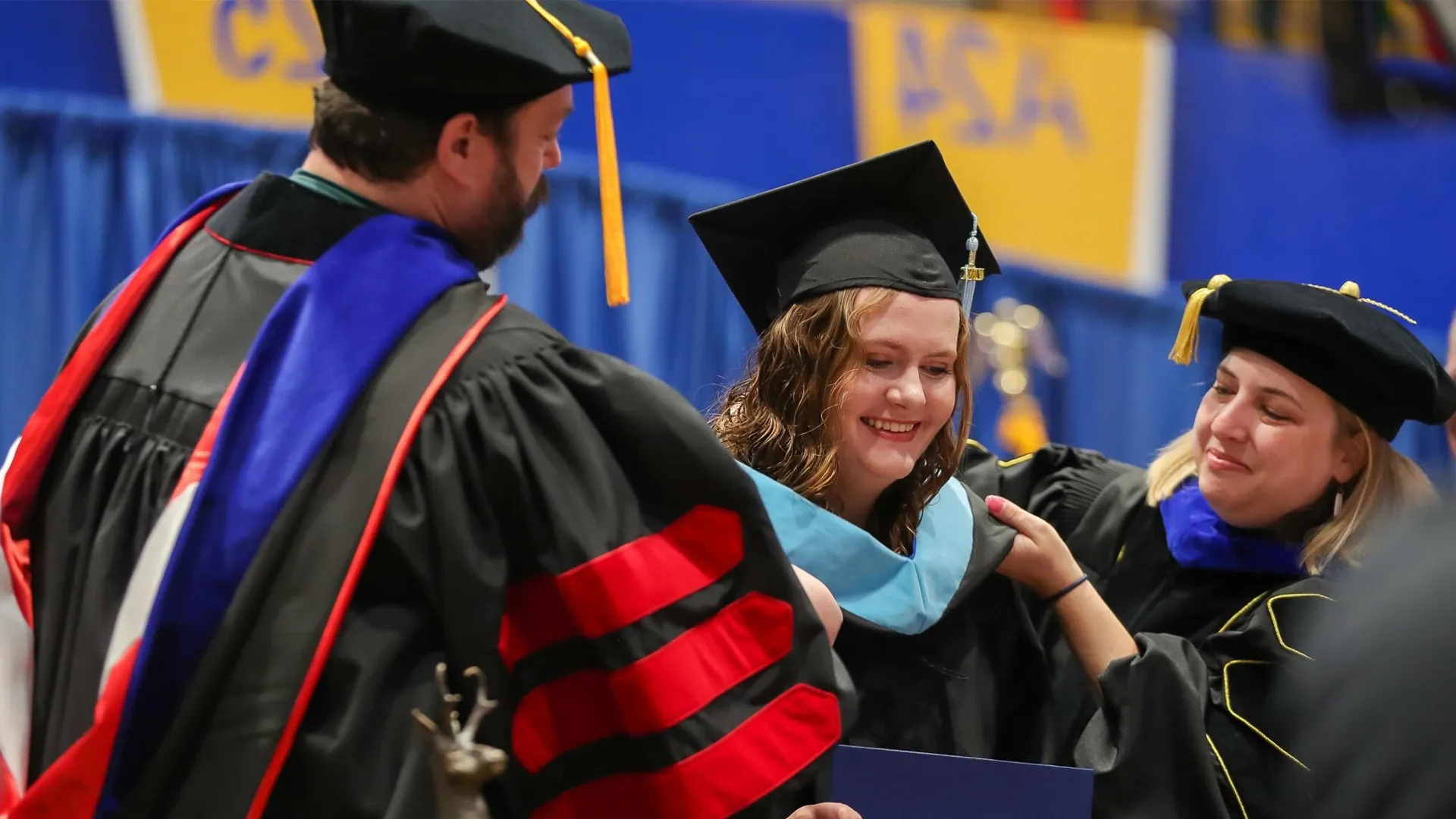 a student is awarded a hood at commencement